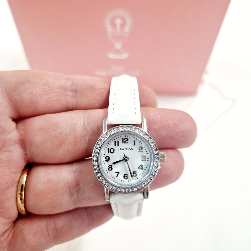White watch with spare pink strap