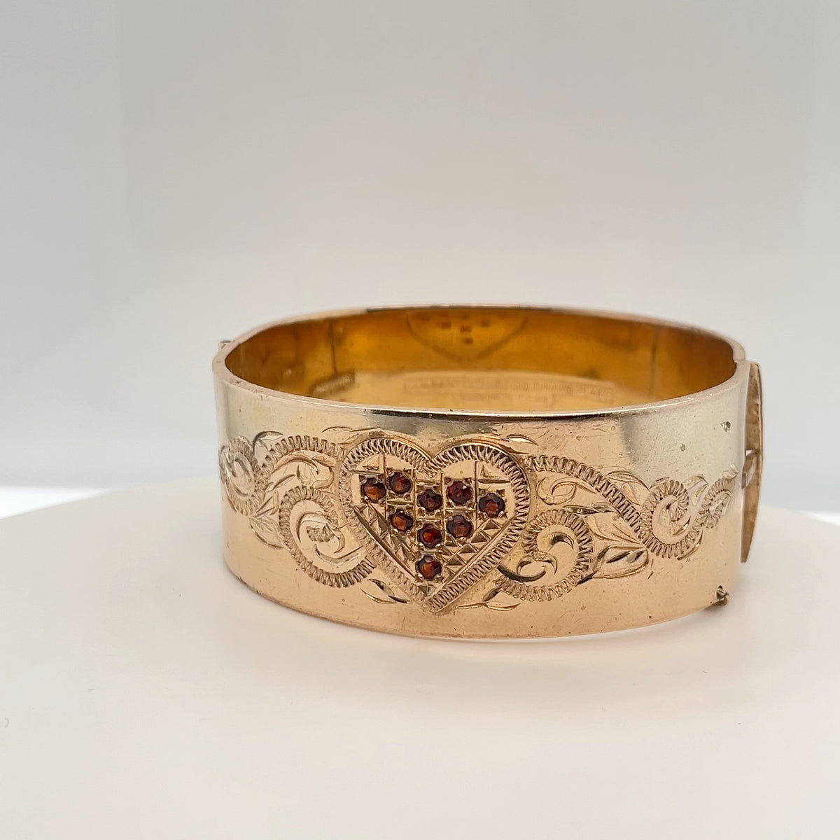 Wide Vintage Bangle with Hand Engraved Design around the Garnet stones