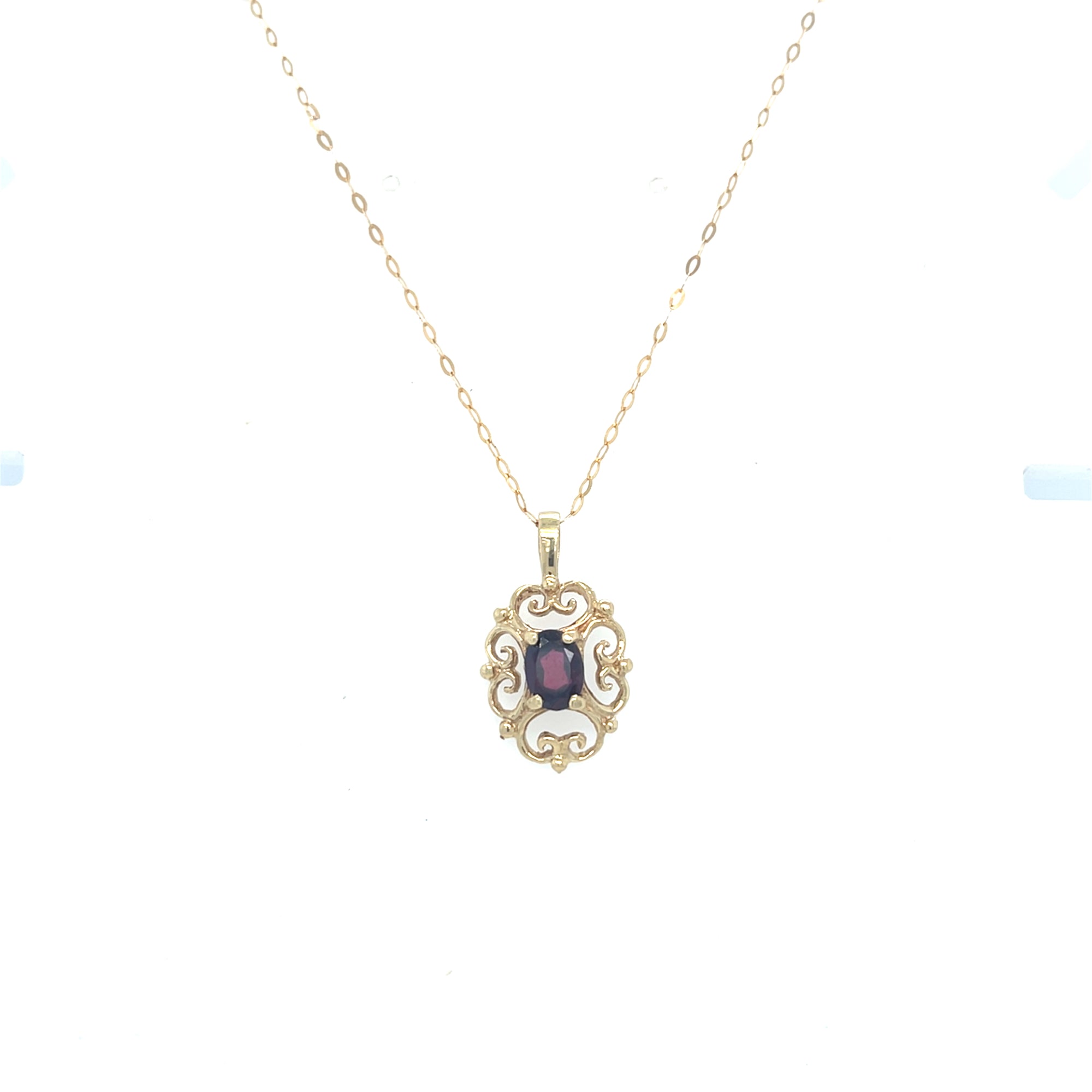 9kt Gold Pendant with garnet stone