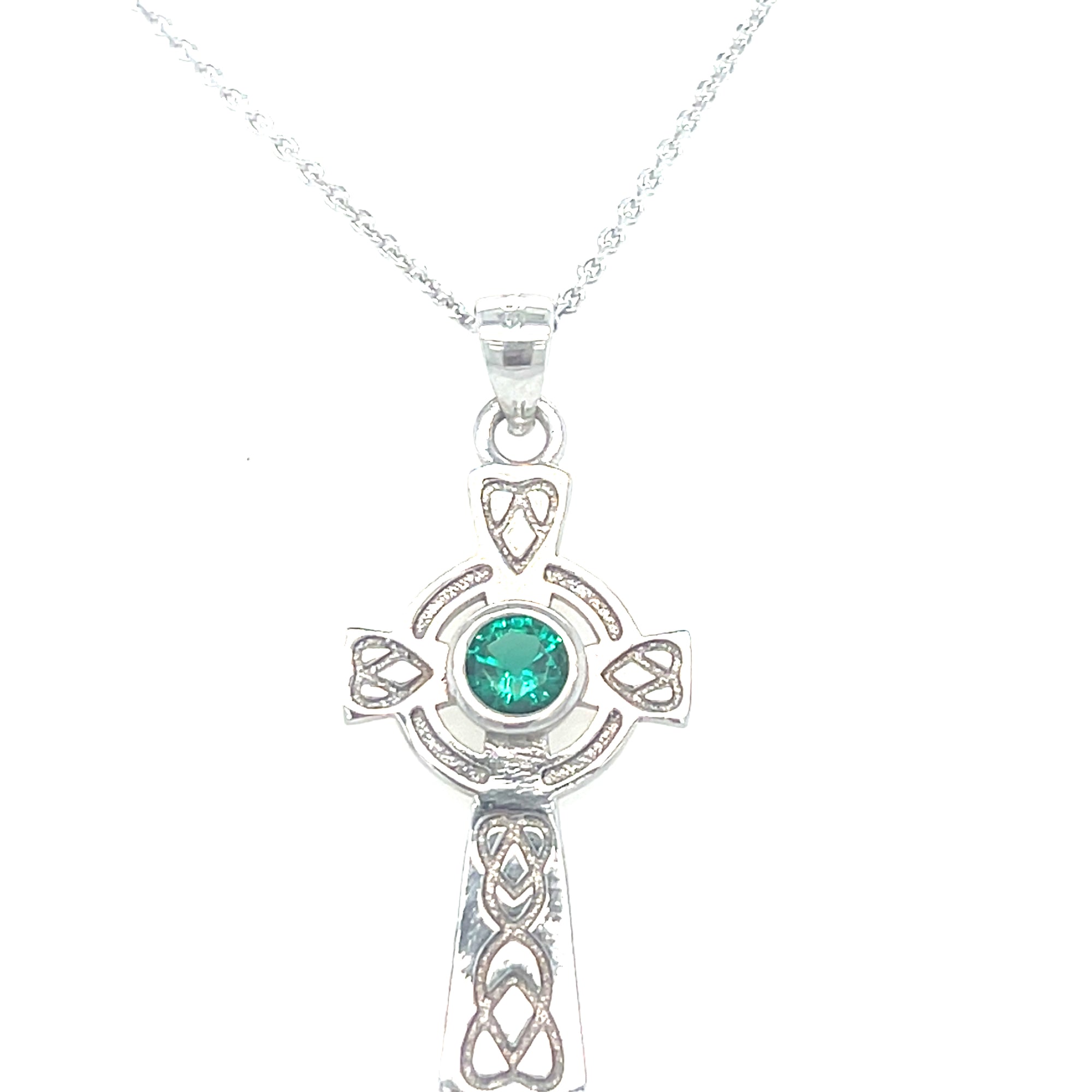 Sterling silver cross with green stone