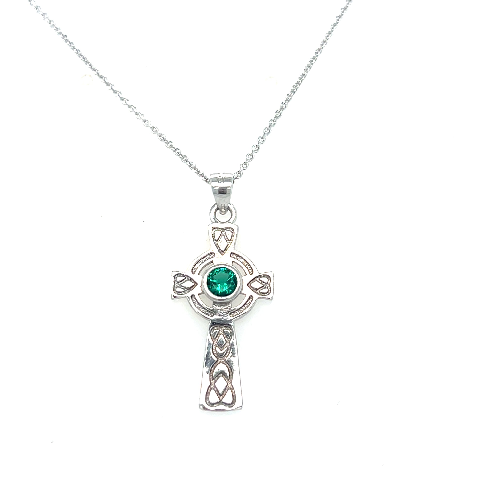 Sterling silver cross with green stone
