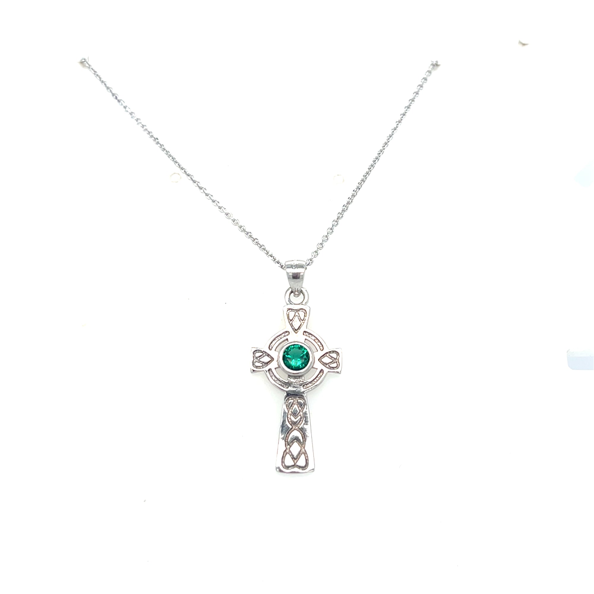 Sterling silver cross with green stone