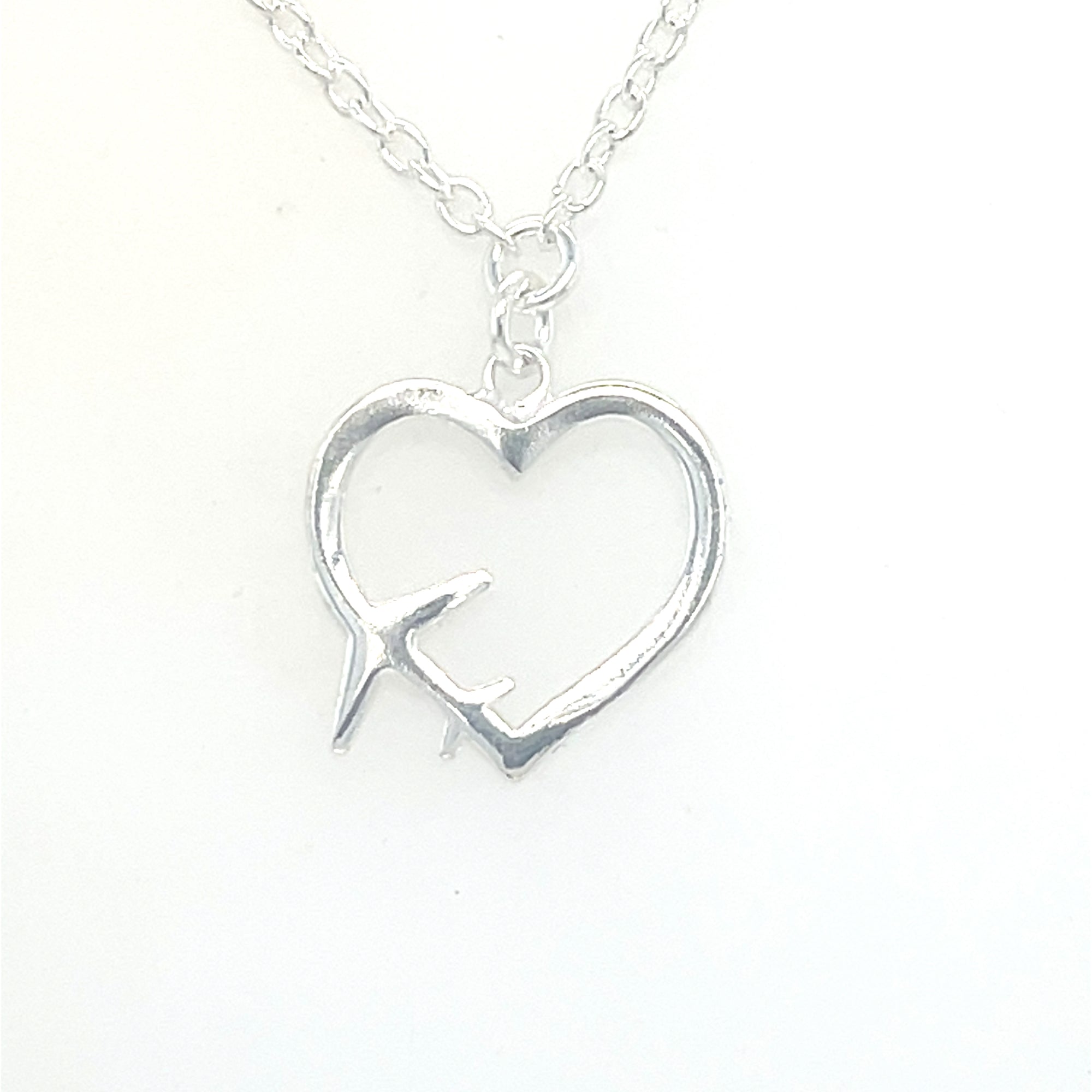 Sterling Silver Heart Pendant with Plane Symbol