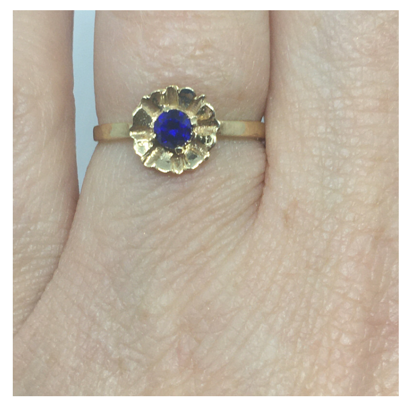 Gold Flower Style ring with Blue Stone Centre