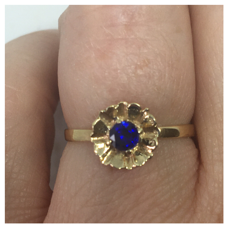 Gold Flower Style ring with Blue Stone Centre