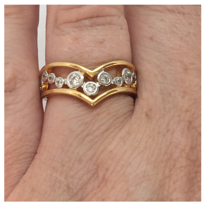 Gold plated V shaped ring with clear stones