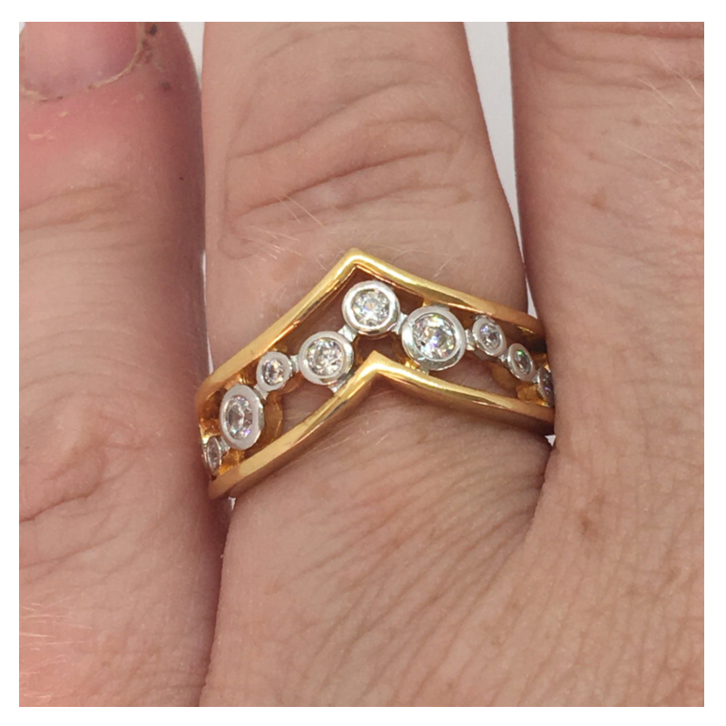 Gold plated V shaped ring with clear stones