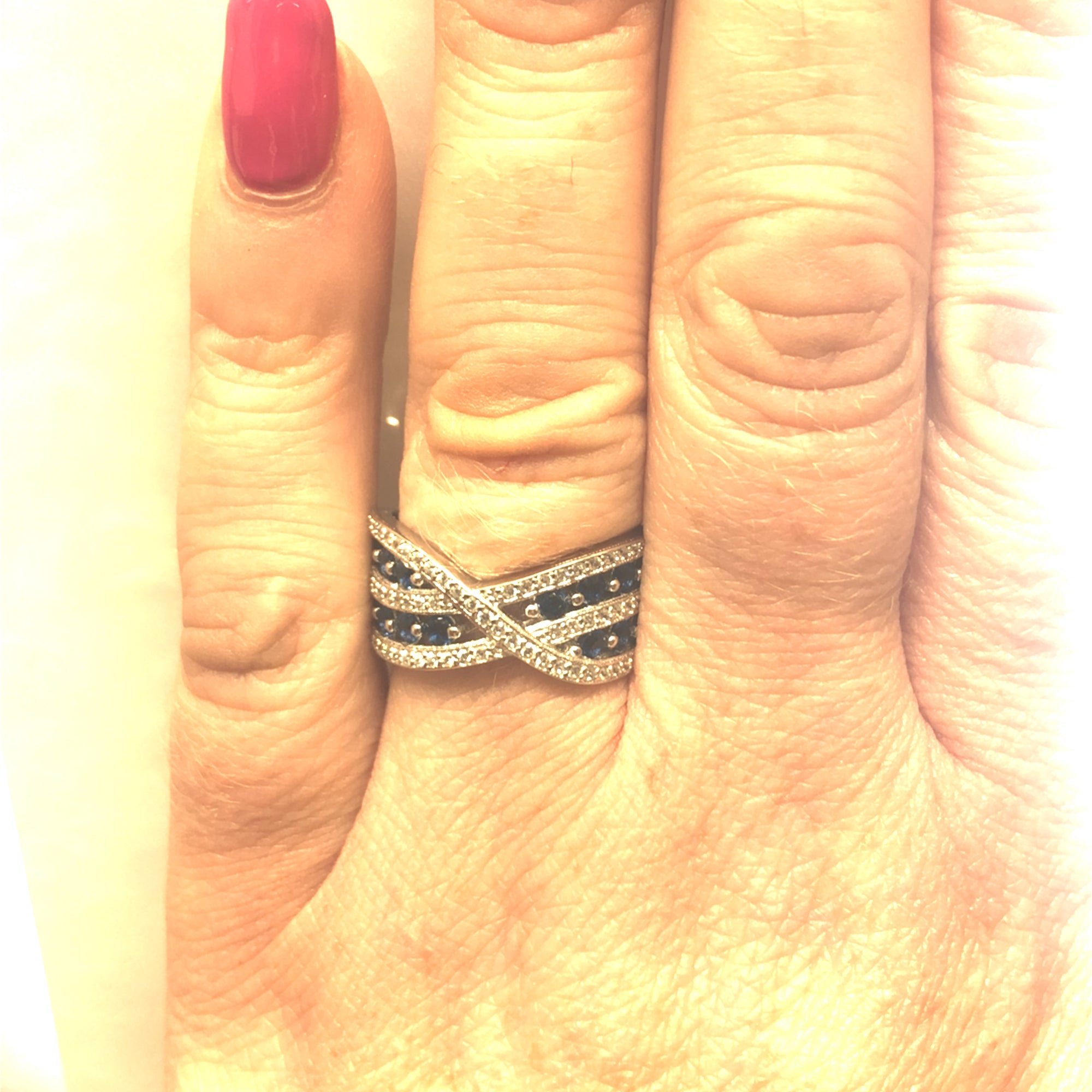 Sterling Silver Crossover Style Ring with Clear and Blue Stones