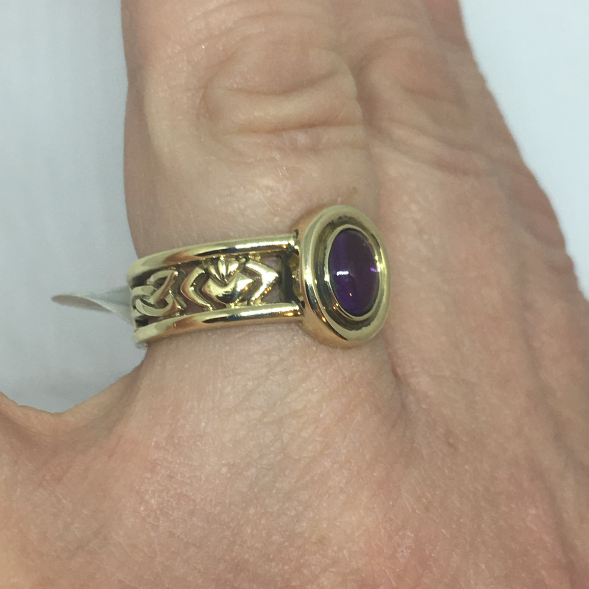 Gold Celtic Band with a Amethyst Stone